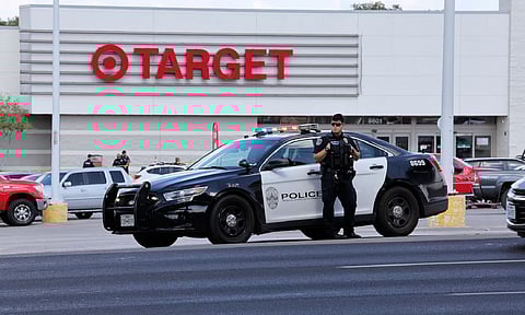 Police block the entrance to a Target after a shooting in Austin (AP)