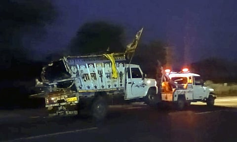 Wreckage of a vehicle being taken away after a pickup van allegedly crashed into a parked truck, in Rajasthan's Dausa district, Wednesday, Aug. 13, 2025 (PTI)&nbsp;