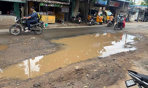 The long crater covered by rain water on the Tiruvottiyur High Road&nbsp;