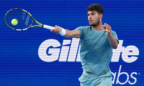 Carlos Alcaraz plays a forehand shot against Alexander Zverev


