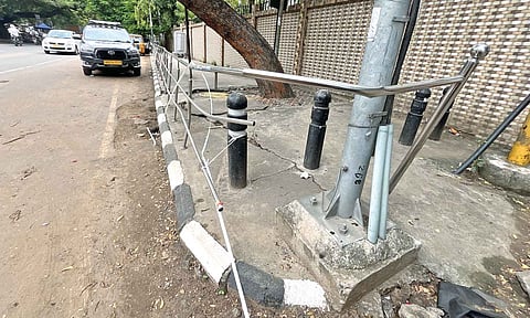 Broken handrails protrude dangerously in front of a private school on Ormes Road, Kellys