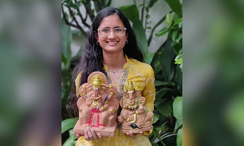 Krisha with eco-friendly Vinayagar idols