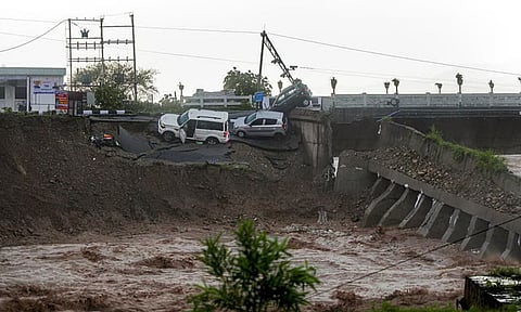 Vehicles stuck as a portion of the Fourth Tawi Bridge damaged (PTI)