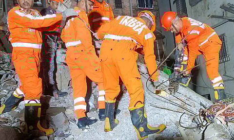 NDRF personnel during a rescue operation after the rear portion of a four-storey building crashed onto a chawl at Vasai, in Palghar district, Maharashtra (PTI)