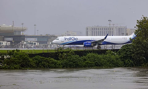 An IndiGo aircraft stationed at Chhatrapati Shivaji Maharaj International Airport amid the rising water level of the nearby Mithi River due to heavy rainfall, at Kurla, in Mumbai, Monday, Aug. 18, 2025 (PTI)&nbsp;