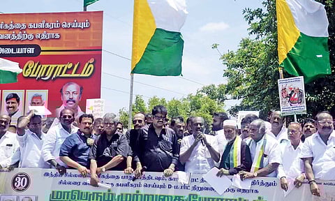 Tamil Nadu Vanigar Sangangalin Peramaippu president&nbsp; Vikkramaraja leads a protest in Vayalur, on Saturday&nbsp;