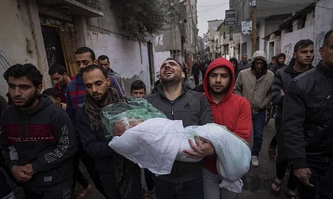 Amnesty International accused Israel of committing genocide in the Gaza Strip during its war with Hamas, saying it has sought to deliberately destroy Palestinians by mounting deadly attacks, demolishing vital infrastructure, and preventing the delivery of food, medicine and other aid (AP)