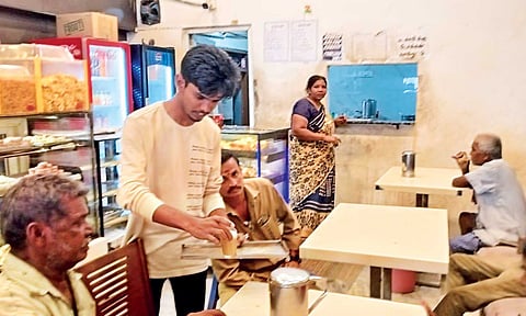 Haripriyan serving customers at the bakery where he works&nbsp;