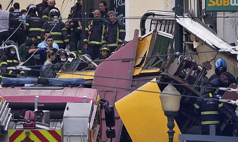 Emergency teams work at the site of a derailed electric streetcar in Lisbon, Portugal, Wednesday, Sept. 3, 2025. (AP Photo)
