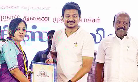 Deputy Chief Minister Udhayanidhi Stalin handing over an award to a teacher on the occasion of Teachers’ Day on Friday