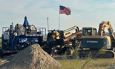 An American flag flies above a piece of heavy machinery at the site of Hyundai Motor Group's electric vehicle plant in Ellabell, Georgia, Friday, Sept. 5, 2025 (AP)