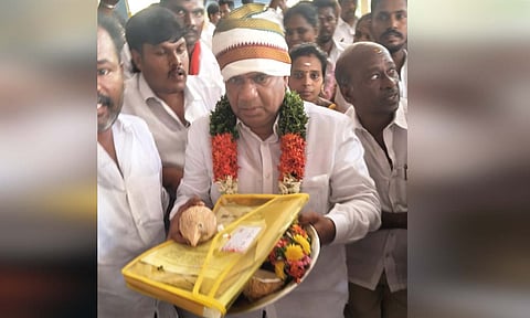 TVK general secretary N Anand at Siddhi Vinayagar temple in Tiruchy, placing the permission letter seeking divine blessings on Saturday&nbsp;