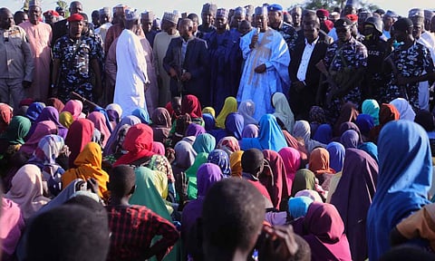 BOMO state Governor Babagana Zulum, center back, speaks to people affected by a Boko Haram attack, as he visits the area in Darul Jamal, Nigeria (AP)&nbsp;