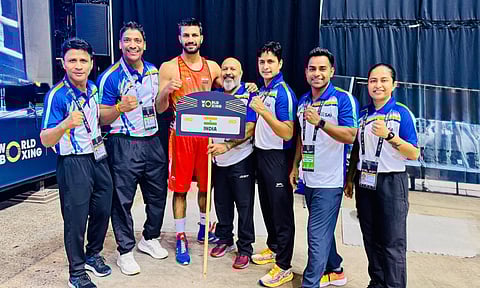 Lakshya Chahar with his coaches after the win