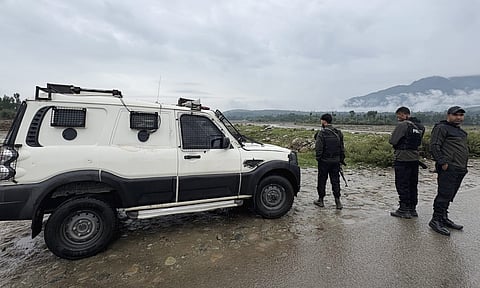 Security personnel at the site after an encounter broke out in Guddar forest of Kulgam district (PTI)