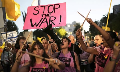 People take part in a protest demanding the immediate release of all hostages held by Hamas and calling for the end to the war in Gaza, in Jerusalem (AP)