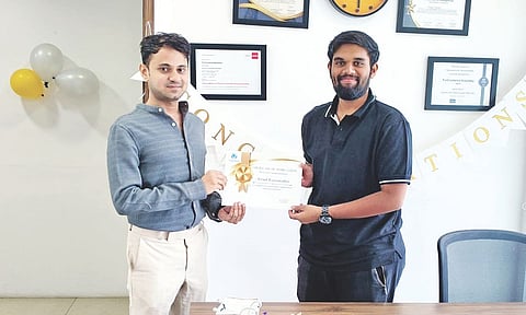 Ashank Raamanathan (right) receiving the certificate from Shaaz Faruqui, co-founder, FinChartered Academy