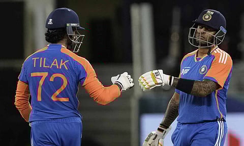 India's Tilak Varma, left, and batting partner Suryakumar Yadav celebrate scoring runs during the Asia Cup cricket match between India and Pakistan at Dubai International Cricket Stadium in Dubai, United Arab Emirates (PTI)&nbsp;