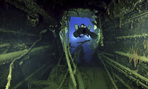 In this undated photo provided by the Greek Culture Ministry on Monday, Sept. 15, 2025, divers illuminate the wreck’s interior of the Britannic, sister ship to the Titanic, for the first time since the ocean liner sank in the Aegean Sea more than a century ago after striking a mine during World War I. (AP)
