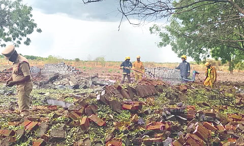 Firefighters extinguish fire following the blast