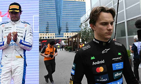 Max Verstappen (R) and third-placed Williams' Carlos Sainz on the podium
