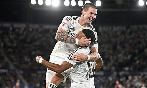 Franco Mastuantono (L) celebrates after scoring with Kylian Mbappe
