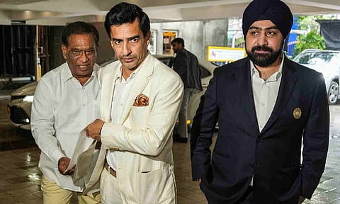 Former cricketer and BCCI Presidential candidate Mithun Manhas, left, and the cricket board�s Honorary Treasurer Prabhtej Singh Bhatia arrive for the board's Annual General Meeting (AGM) at its headquarters, in Mumbai, Sunday (PTI)