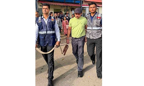 North East India Festival (NEIF) chief organiser Shyamkanu Mahanta, alleged to be involved in the death of singer Zubin Garg in Singapore, is brought to the CID office following his arrest from Delhi, in Guwahti, Assam, Wednesday, Oct. 1, 2025 (PTI)&nbsp;