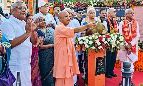 Nirmala Sitharaman and Yogi Adityanath during the unveiling ceremony of statues of South Indian saints Tyagaraja Swamigal, Purandara Dasa and Arunachal Kavi at the Brihaspati Kund in Ayodhya (PTI)