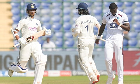 India's KL Rahul, right, between overs on day one of the second and final Test cricket match of a series between India and West Indies, at the Arun Jaitley Stadium (PTI)