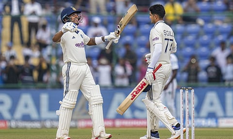 India's captain Shubman Gill, right, celebrates his century with Dhruv Jurel on day two of the second and final Test cricket match of a series between India and West Indies, at the Arun Jaitley Stadium, in New Delhi, Saturday, Oct. 11, 2025. (PTI Photo/Shahbaz Khan)
