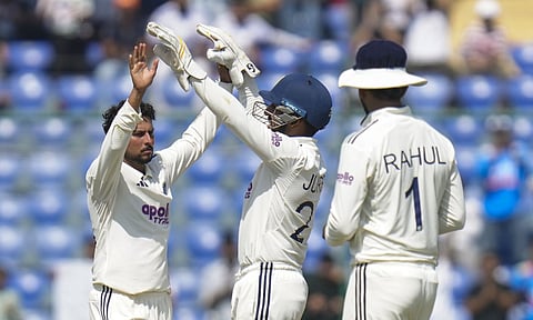 &nbsp;Kuldeep Yadav celebrates the wicket of West Indies' Jayden Seales as he completes his five-wicket haul on day three of the second and final Test cricket match of a series between India and West Indies, in New Delhi, Sunday, Oct. 12, 2025. (PTI)