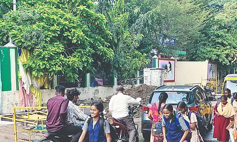 Schoolkids, office-goers and motorists navigating 4th Main Road, Villivakkam, filled with sewage-mixed rainwater