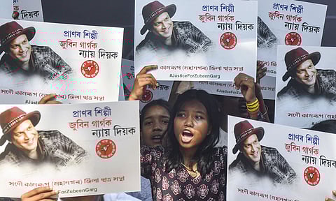 All Assam Students' Union (AASU) members hold posters during a protest demanding justice for late music icon Zubeen Garg, in Guwahati (Photo: PTI)
