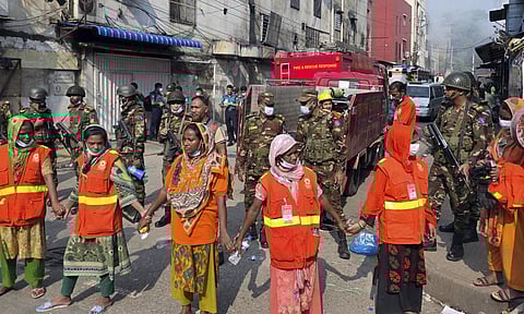 Army personnel at the site for a search campaign in the blaze-damaged structures, in Dhaka, Bangladesh. (Photo: PTI)