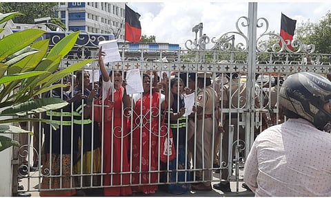 NULM workers are waiting outside the Ripon building gate to submit their petitions on Thursday