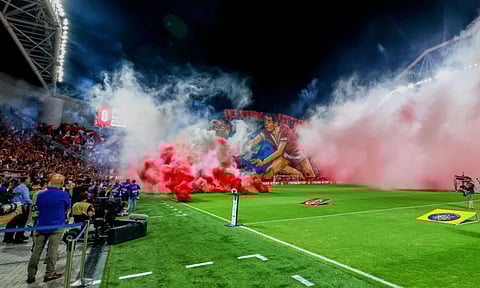Smoke from flares thrown by fans fills the field before the soccer derby between Maccabi Tel Aviv and Hapoel Tel Aviv was called off Sunday after pregame disturbances led police to deem it unsafe to proceed at Bloomfield Stadium in Tel Aviv, Israel, Sunday. (Photo: AP)