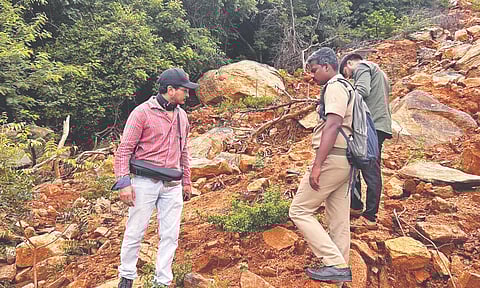 Officials inspect the affected area in Annamalai hills