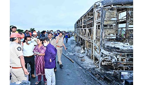 Police personnel investigate the spot after a Hyderabad-bound private bus caught fire following a collision with a two-wheeler, near Chinnatekur in Kurnool district, Andhra Pradesh, Friday, Oct. 24, 2025. At least 12 people were killed in the accident (PTI)&nbsp;