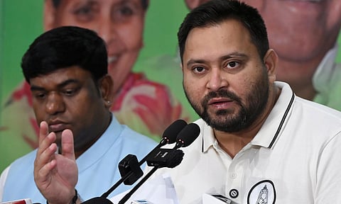 RJD Leader of Opposition Tejashwi Yadav addresses a press conference at his official residence in Patna (PTI)