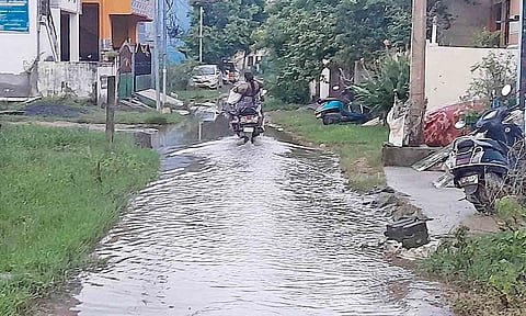 &nbsp;A two-wheeler plying on the sewage-filled 5th Street in East Gopalapuram