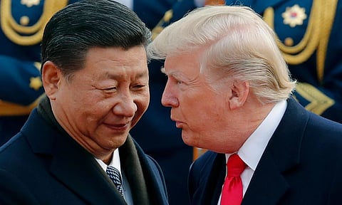 U.S. President Donald Trump, right, chats with Chinese President Xi Jinping (Photo: AP)