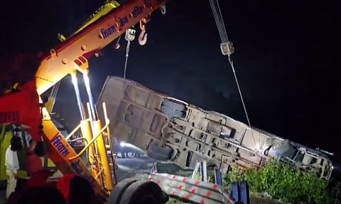 Rescue work underway after a passenger bus fell into a gorge, in Indore, Madhya Pradesh, Monday night (PTI)