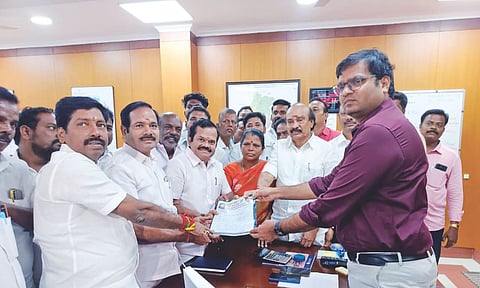 AIADMK functionaries submitting a petition to Tiruchy Collector Saravanan