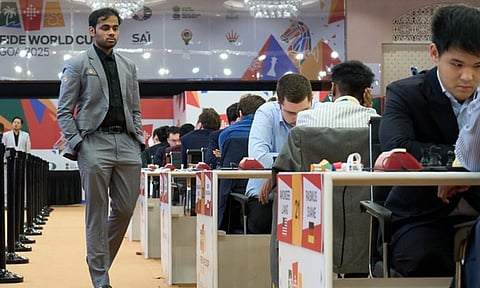 GM Arjun Erigaisi observes games in progress during Round 3 at the playing hall