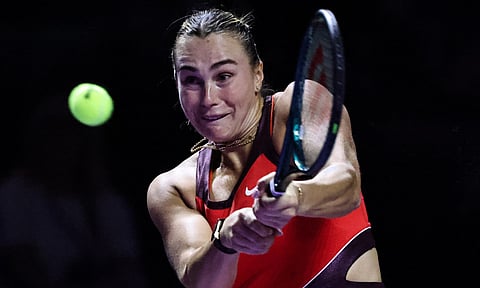 Aryna Sabalenka returns a shot against Coco Gauff