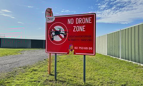 A no drone sign just outside the perimeter of Brussels International Airport in Zaventem, Belgium, after reported overnight drone activity over the airport. (Photo: AP)