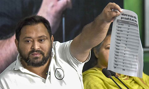 RJD leader and Leader of Opposition in Bihar Assembly Tejashwi Yadav addresses a press conference, in Patna, Monday (PTI)&nbsp;