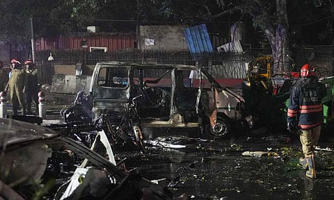 Rescue work underway amid mangled remains of vehicles after a blast occurred in a parked car near Red Fort, leaving multiple vehicles in flames, in New Delhi, Monday, Nov. 10, 2025 (PTI)&nbsp;