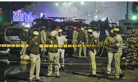 Police personnel at the site after a blast in a parked car near Red Fort left multiple vehicles in flames, in New Delhi, Monday, Nov. 10, 2025. (PTI Photo)